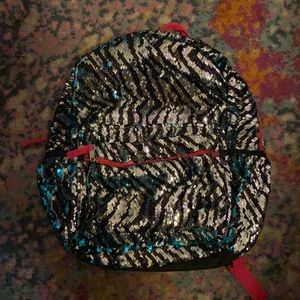 Blue, silver and black flip sequence backpack